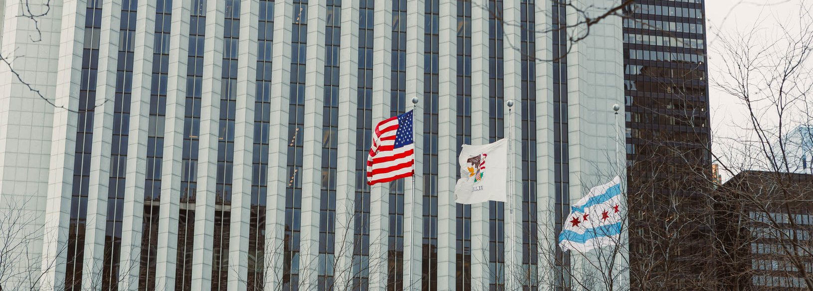Chicago commercial property Downtown Chicago commercial building flying the United States, Illinois and Chicago flags