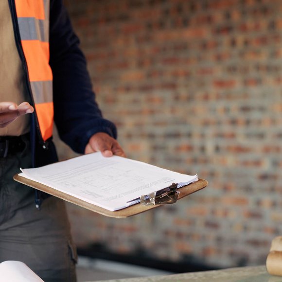 Maintenance standard of care Inspector with a clipboard reviewing maintenance practice